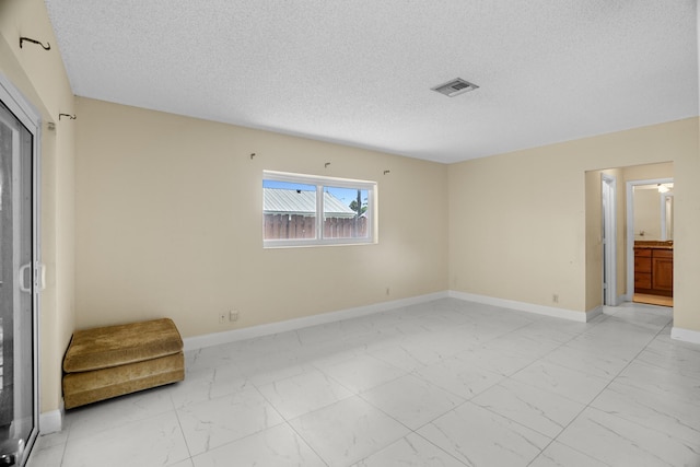 100 SW 15th Ct, Boca Raton, FL 33486 - interior space with baseboards, marble finish floor, a textured ceiling, and visible vents