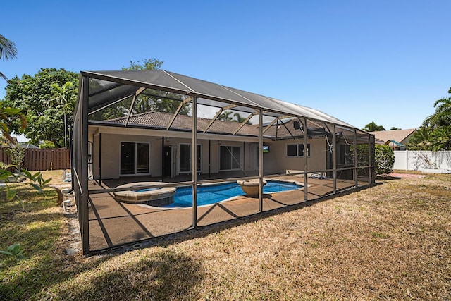 100 SW 15th Ct, Boca Raton, FL 33486 - rear view of property with stucco siding, a fenced backyard, a patio, and a lanai