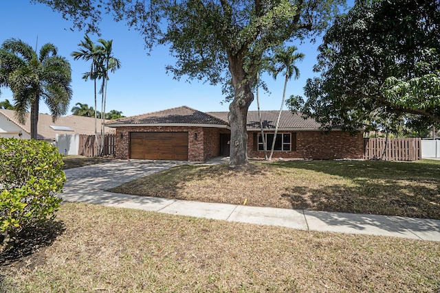 100 SW 15th Ct, Boca Raton, FL 33486 - ranch-style home with brick siding, fence, and an attached garage