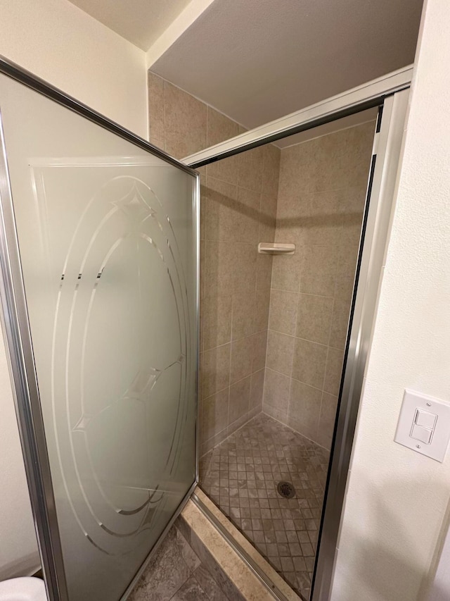 bathroom with an enclosed shower