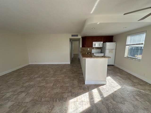 kitchen with backsplash, white appliances, and ceiling fan