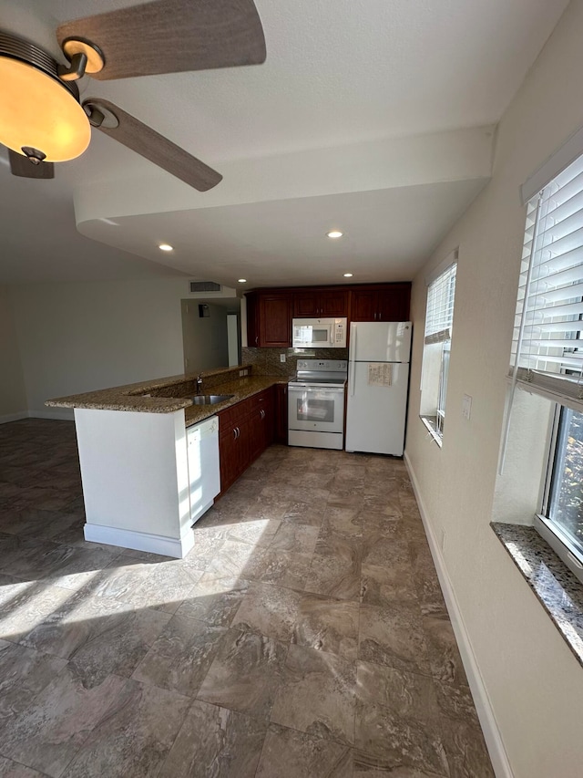 kitchen featuring kitchen peninsula, ceiling fan, sink, and white appliances