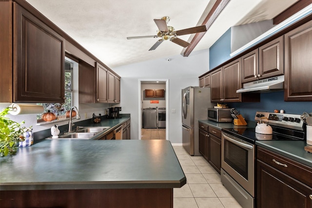 kitchen featuring sink, stainless steel appliances, washing machine and dryer, dark brown cabinets, and light tile patterned floors