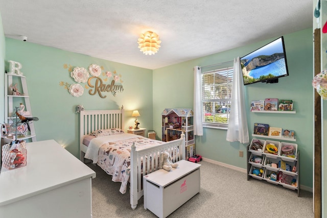 carpeted bedroom featuring a textured ceiling