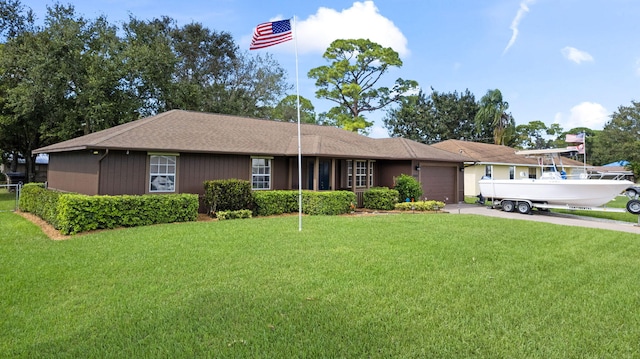 single story home with a front yard