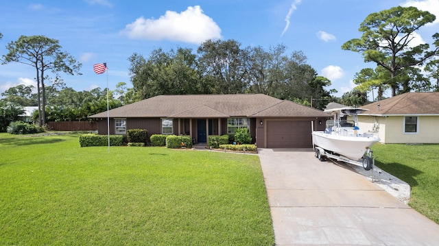 ranch-style house with a garage and a front yard