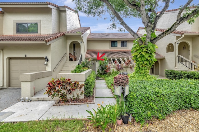 mediterranean / spanish-style house featuring a garage