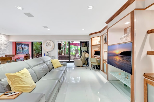 living room with ornamental molding and light tile patterned floors