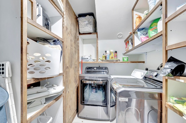 laundry area with washing machine and clothes dryer