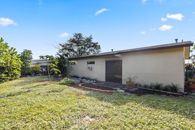 back of house with a yard