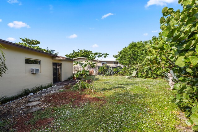 view of yard featuring a wall mounted AC