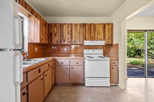 kitchen with white appliances and sink