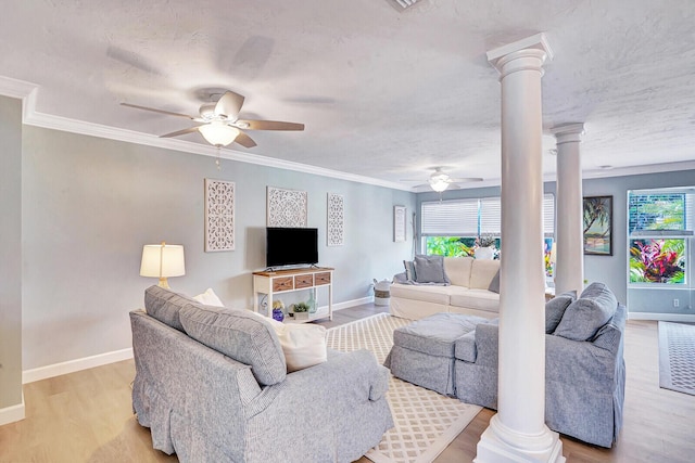 704 Eastwind Dr, North Palm Beach, FL 33408 - living room with baseboards, decorative columns, light wood-type flooring, and ceiling fan