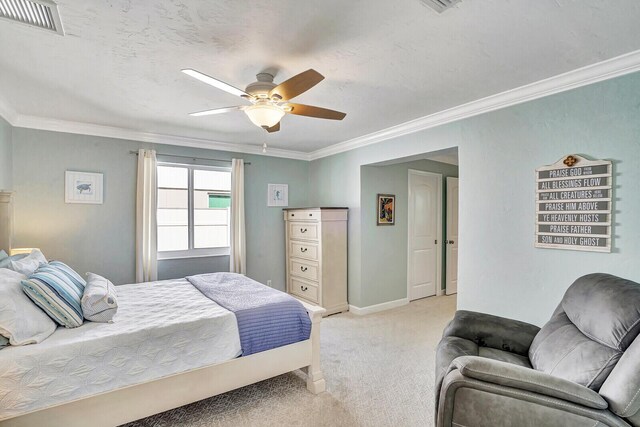 704 Eastwind Dr, North Palm Beach, FL 33408 - bedroom featuring a ceiling fan, visible vents, light carpet, baseboards, and ornamental molding