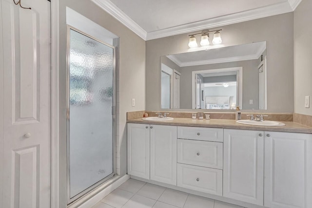 704 Eastwind Dr, North Palm Beach, FL 33408 - full bathroom featuring double vanity, a shower stall, crown molding, and a sink