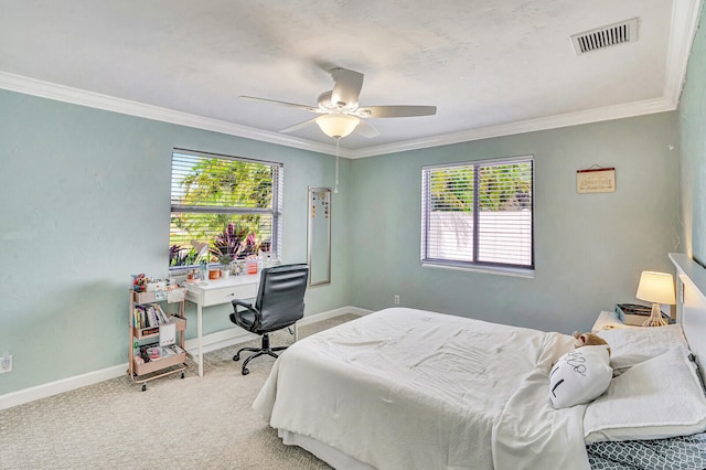 bedroom with ornamental molding, carpet floors, and ceiling fan