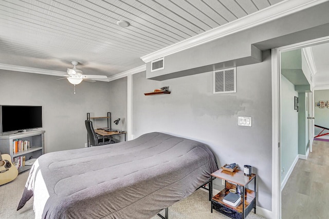 704 Eastwind Dr, North Palm Beach, FL 33408 - bedroom with baseboards, visible vents, wood finished floors, and crown molding