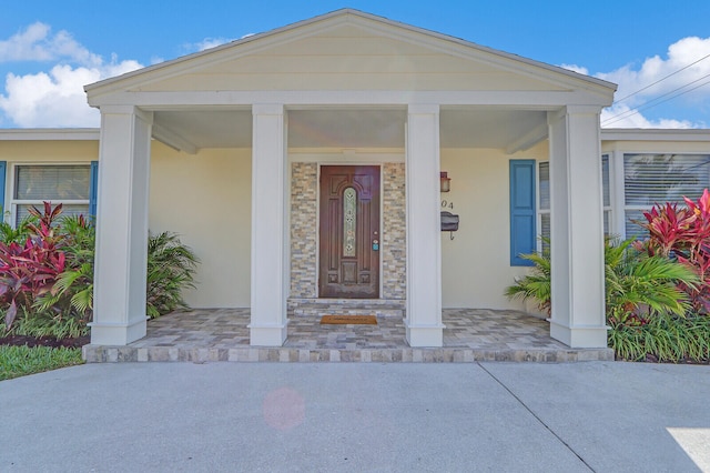 property entrance with covered porch