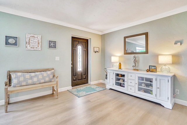 entryway featuring crown molding and light hardwood / wood-style floors