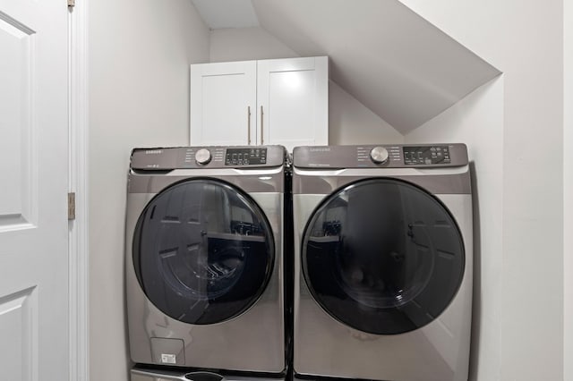 laundry room with cabinets and separate washer and dryer