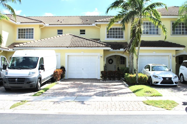 mediterranean / spanish-style house featuring a garage