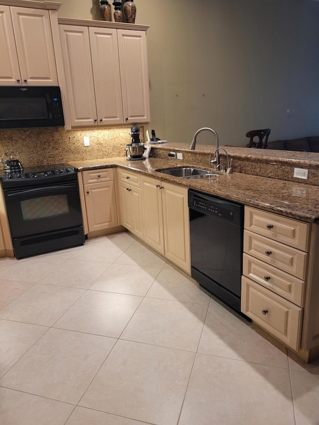 kitchen featuring decorative backsplash, sink, black appliances, light tile patterned floors, and dark stone countertops