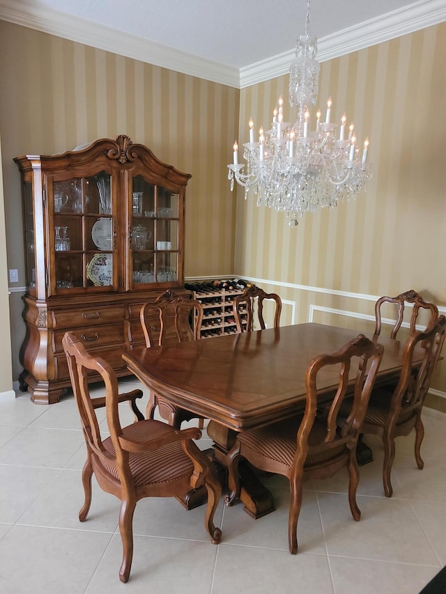 tiled dining space with crown molding and an inviting chandelier