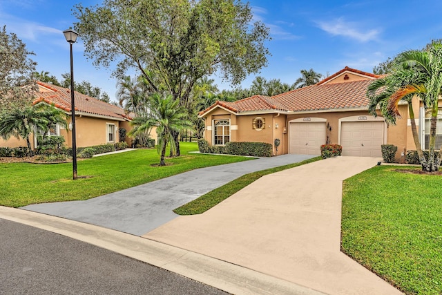 mediterranean / spanish house with a front lawn and a garage