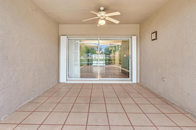 exterior space with ceiling fan