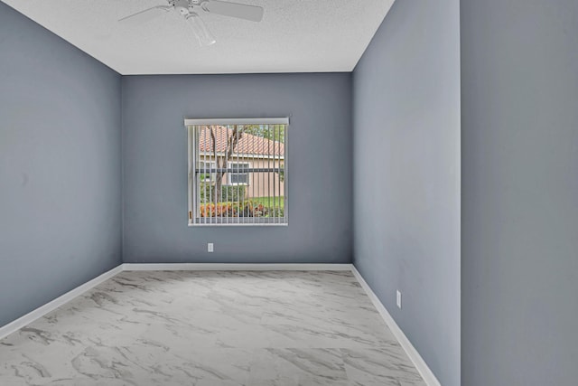 unfurnished room with a textured ceiling and ceiling fan