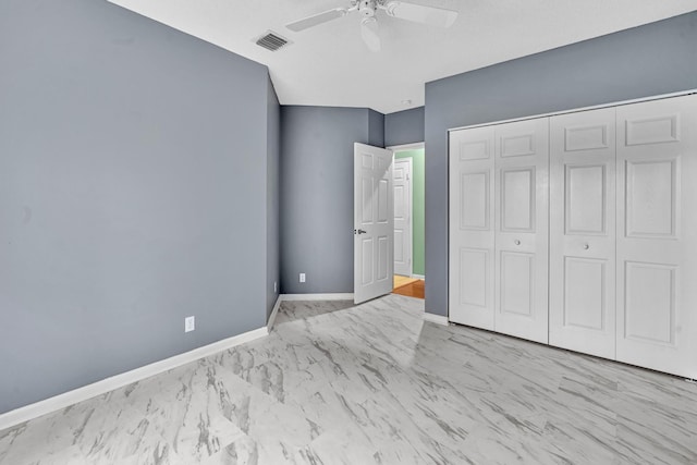 unfurnished bedroom featuring a closet, ceiling fan, and a textured ceiling