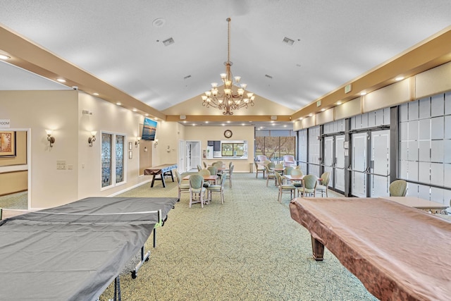 game room with an inviting chandelier, high vaulted ceiling, carpet floors, and billiards