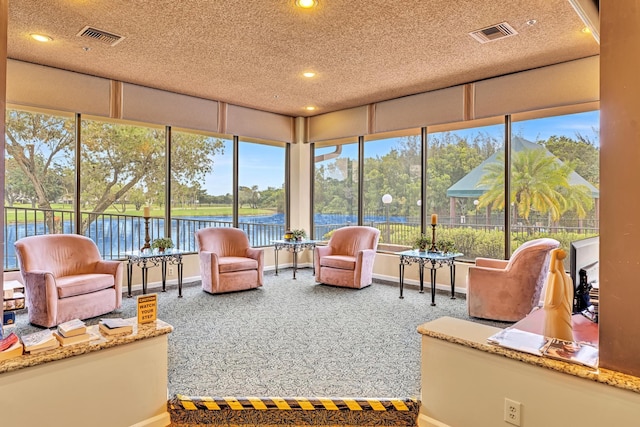 sunroom with a water view