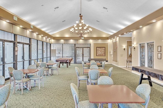 dining area featuring high vaulted ceiling, billiards, and an inviting chandelier