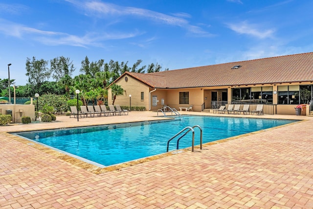 view of pool featuring a patio area