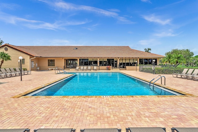 view of swimming pool with a patio