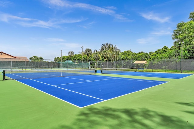 view of tennis court with basketball court