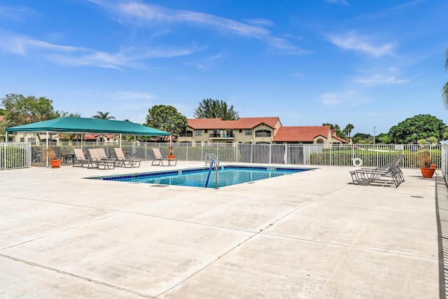 view of swimming pool with a patio