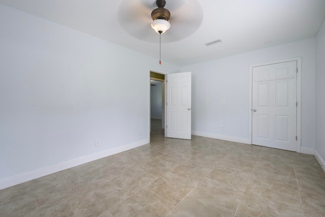 unfurnished bedroom featuring ceiling fan