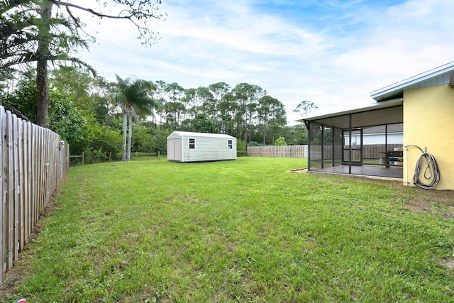 view of yard with a storage unit and a sunroom