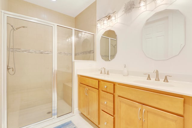 bathroom with vanity, walk in shower, and tile patterned flooring