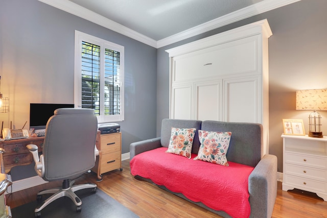 bedroom featuring crown molding and light wood-type flooring