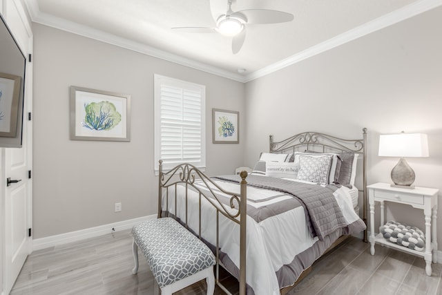 bedroom with ornamental molding, light hardwood / wood-style flooring, and ceiling fan