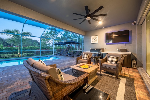 view of patio featuring area for grilling, ceiling fan, a lanai, and outdoor lounge area