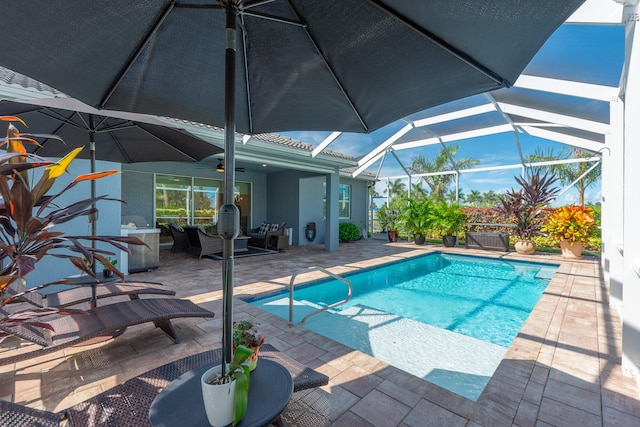 view of pool featuring a patio and glass enclosure