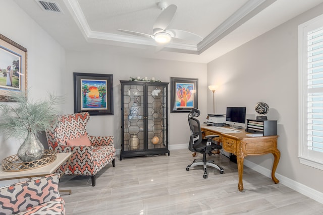 office with ornamental molding, ceiling fan, and a raised ceiling