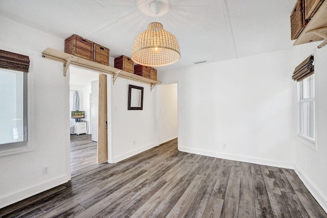 spare room with dark wood-type flooring