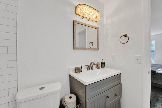 bathroom with toilet and vanity