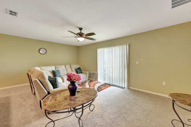 living room featuring light colored carpet and ceiling fan