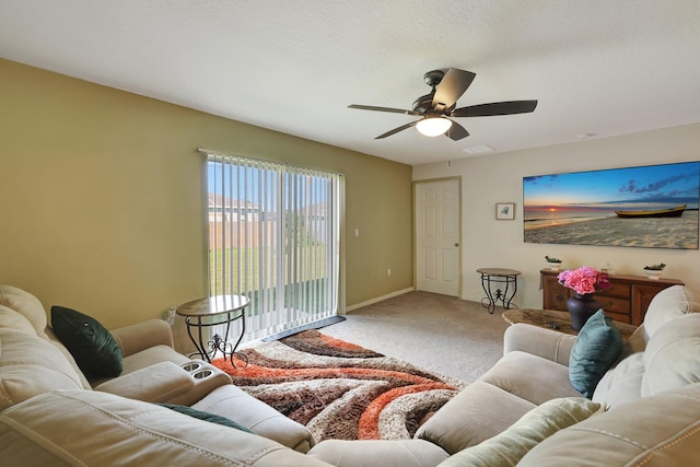 living room with ceiling fan and carpet flooring